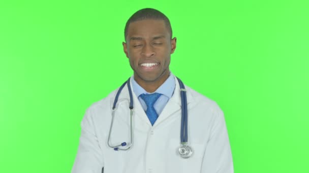 Thumbs Up by Young African Doctor on Green Background - Metraje, vídeo