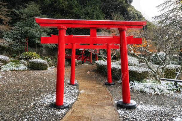 Inari shrine gate in Umi Jigoku covered in snow. Taken in Umi Jigoku one of Beppu Jigoku tours in Japan. - Photo, Image