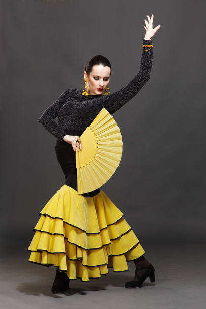Flamenco dancer in a yellow skirt - Zdjęcie, obraz
