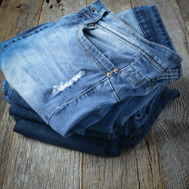 Denim Jeans op hout achtergrond - Foto, afbeelding