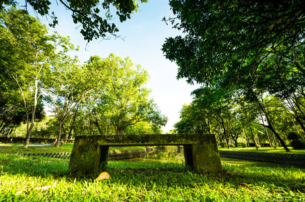 Public park with concrete bench in Chiang Mai Province, Thailand. - Fotó, kép