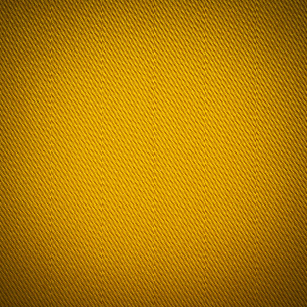 Background texture of yellow fabric closeup with vignette - 写真・画像