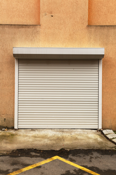 front view of metallic garage door - Foto, Imagen