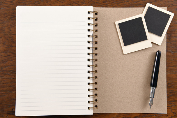 Blank notebook with pen and photo frames - Φωτογραφία, εικόνα