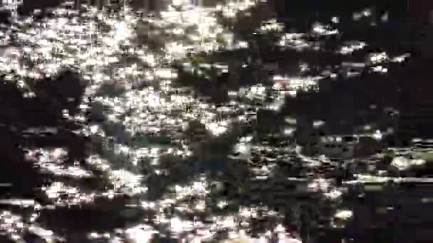 Glare on the water, sun reflection on the water on the sea - Video