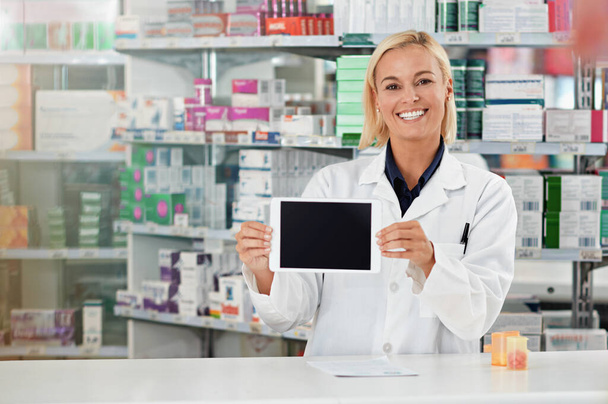 Tablet screen, pharmacy and pharmacist woman with mockup for medical software, e commerce and online medicine. Digital technology, retail application and portrait of healthcare worker show mock up. - Foto, imagen