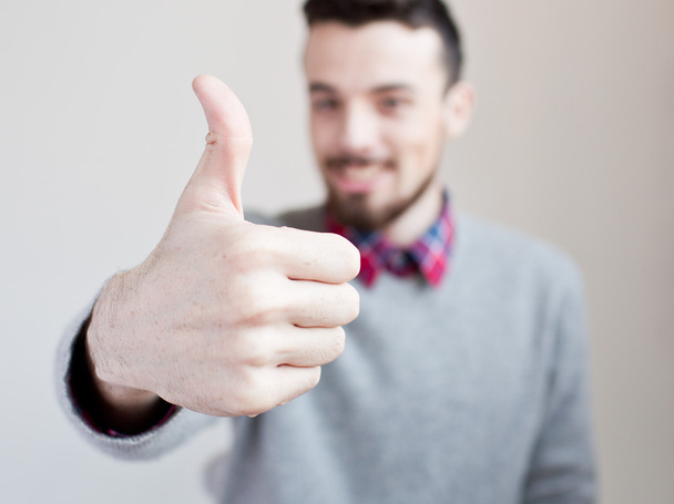 Man showing thumb up - Foto, afbeelding