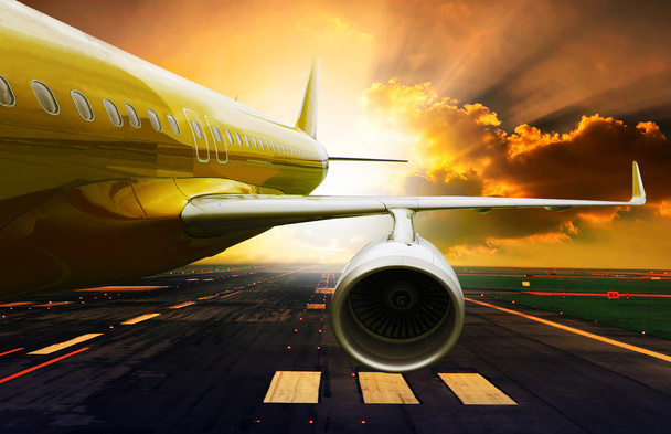 Passenger plane take off from runways against beautiful dusky sk - Photo, Image