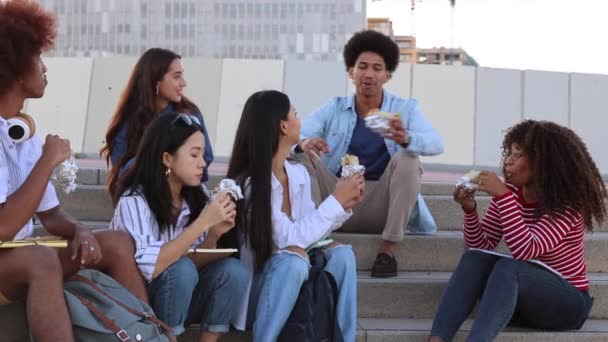 multiracial group of college students walking out of college - Video