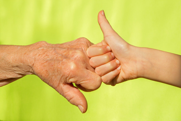 Hand of senior and child - Foto, Bild