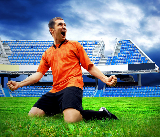 Happiness football player after goal on the field of stadium und - Фото, зображення