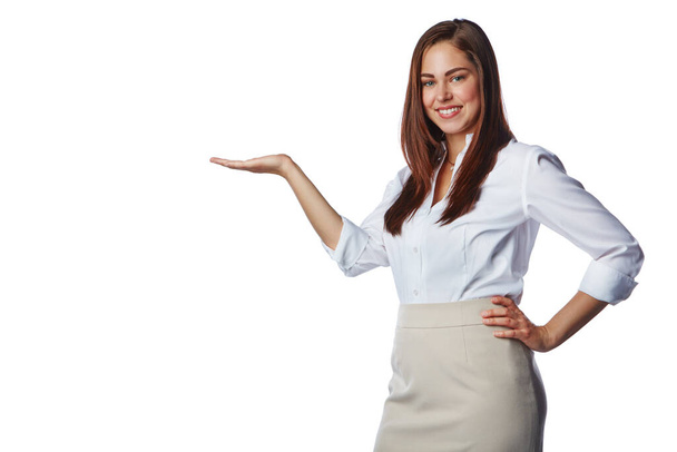 Advertising, display and woman with hand on a white background for product placement, sign and deal. Presentation, mockup and isolated girl with hand gesture for information, news and announcement. - Foto, Imagem