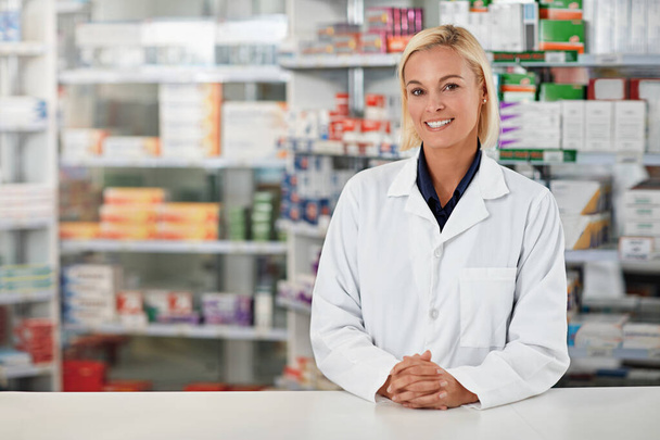 Pharmacy, pharmacist and woman in portrait for medicine, product shelf and retail or healthcare industry. Trust, help desk and medical professional worker smile for inventory, stock and clinic drugs. - Foto, imagen