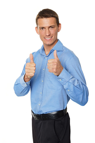 Businessman standing shows thumbs up - Foto, afbeelding