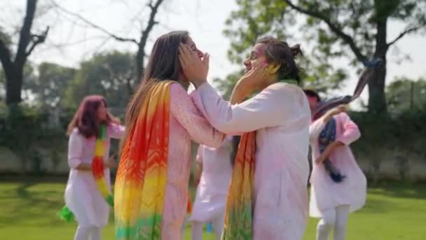 Indian couple enjoying and dancing at a Holi party - Felvétel, videó