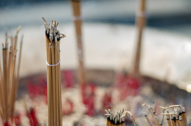 Burning incense sticks in a pot. Incense for praying Buddha or Hindu gods to show worship. bless the holy - Photo, image