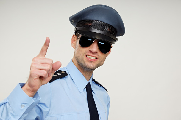 Angry police officer shows at you - Valokuva, kuva