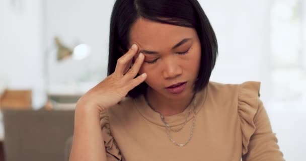 Stress, headache and sad asian woman in office with pain, fear and mental health. Tired worker, burnout and business mistake with anxiety, fatigue and depression of confused problem, crisis and doubt. - Filmati, video