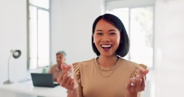 Happy, goofy and face of a business woman in the office with a love, peace and heart hand gesture. Happiness, fun and portrait of a professional female employee from Asia with signs in the workplace - Záběry, video
