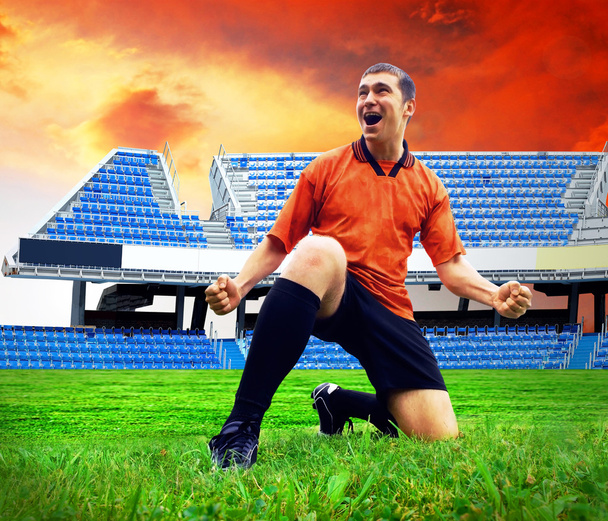 Happiness football player after goal on the field of stadium und - Foto, imagen
