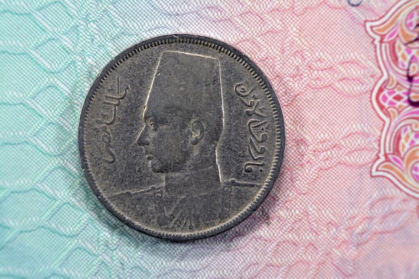 round metal ten Egyptian milliemes series 1941 AD 1360 AH features bust of King Farouk I of Egypt on obverse side and value and date on reverse side, ancient old historic coin of kingdom of Egypt - Fotoğraf, Görsel