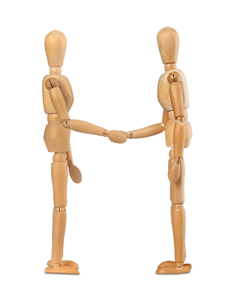 Wooden dummies shake hands - Photo, Image