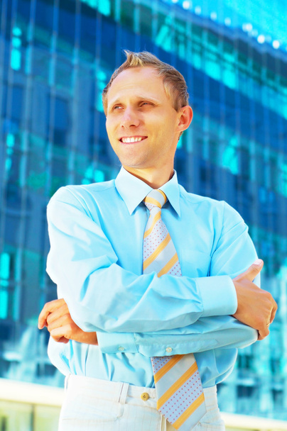 Happiness businessman on blur business architecture background - Zdjęcie, obraz