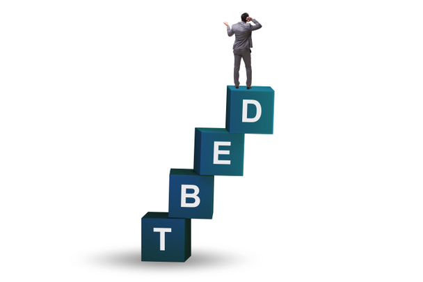 Debt and loan concept with businessman on the cubes - Fotoğraf, Görsel