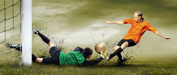 Shoot of football player and goalkeeper on the outdoors field - Φωτογραφία, εικόνα