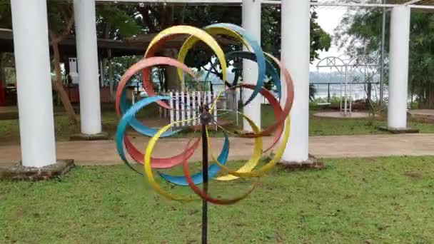 The colorful of propeller at the backyard of cafe. Beautiful motion with wind from the lake. - Video, Çekim