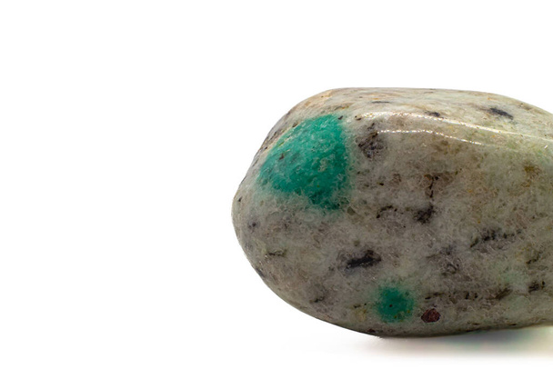 Focused Green K2 Jasper tumbled crystal, K2 granite, tumbled stone green azurite - malachite on white granite macro photography isolated on a white surface background  - Foto, afbeelding