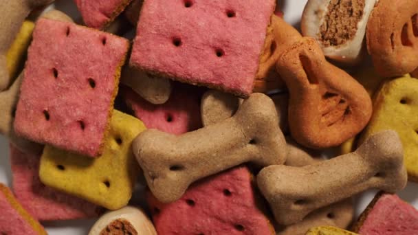 Rotating Dog Treats. Treats for dogs on a white background. Dog food close up. - Séquence, vidéo