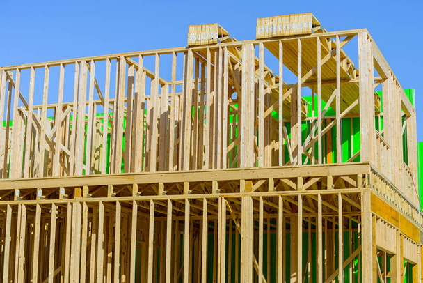 frame of a new plywood house against the sky wood lumber - Zdjęcie, obraz