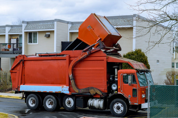 big garbage truck picking up trash wagon car - Foto, Imagem