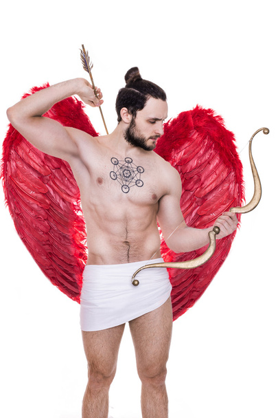 Handsome young guy dressed like Cupid with bow and arrows. Valentine, Archangel, Angel - Foto, Imagem