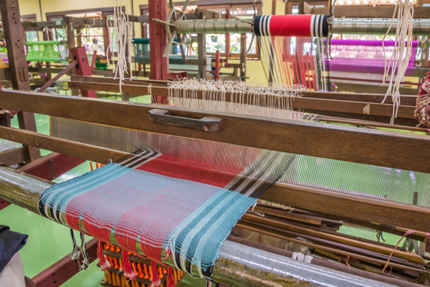 Weaving loom and shuttle on the warp. - Photo, Image
