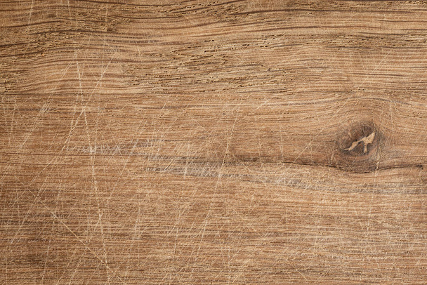 Texture of an old brown wooden board with scratches, oak wood - Photo, Image