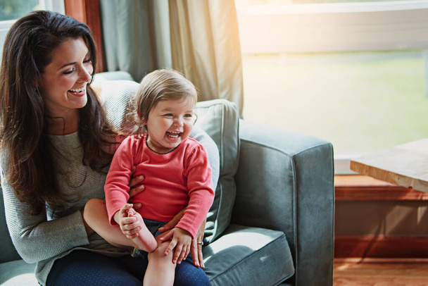 Relax, happy and smile with mother and baby on sofa for bonding, quality time and child development. Growth, support and trust with mom and daughter in family home for health, connection and care. - Foto, Imagen
