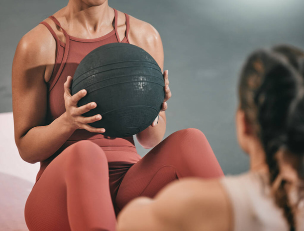 Fitness, team work or women training with medicine ball in workout or exercise with resilience at gym. Motivation, focused girls or healthy female sports athletes with motivation or strong mindset. - Foto, imagen