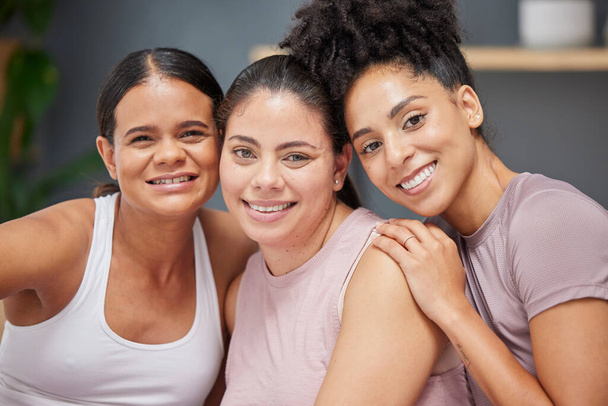 Support, portrait or women in yoga class with a happy smile after group training exercise or fitness workout together. Trust, faces or healthy friends hugging, bonding or relaxing in zen home studio. - Fotoğraf, Görsel
