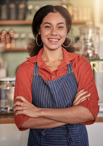 Portrait, cafe barista and woman with arms crossed ready to take your order. Coffee shop, waiter and confident, happy and proud young female waitress from Brazil or small business owner of cafeteria - Valokuva, kuva