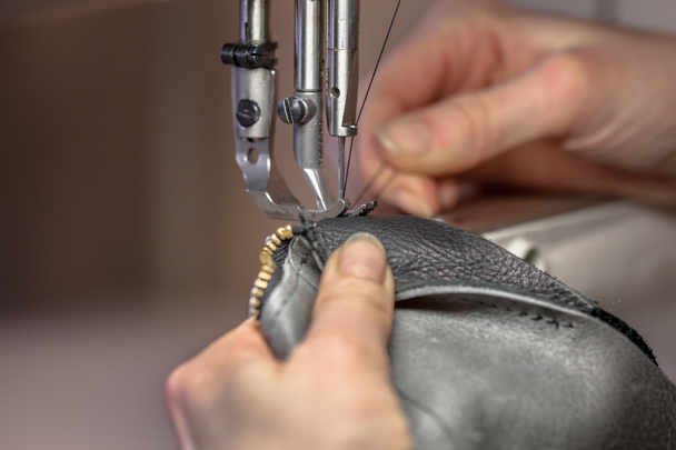 Hands on a sewing machine - Fotó, kép