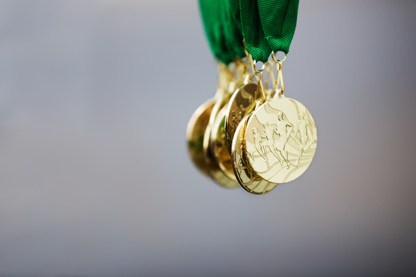 Golden running marathon race medals, award - 写真・画像