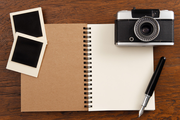 Blank notebook with pen, photo frames and camera - 写真・画像