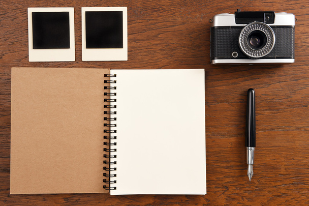 Blank notebook with pen, photo frames and camera - Valokuva, kuva