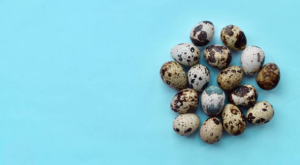Top view of raw quail eggs with text space. High protein rich food. - Photo, Image
