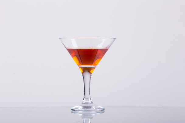 Cold alcoholic cocktail on the white background - Valokuva, kuva