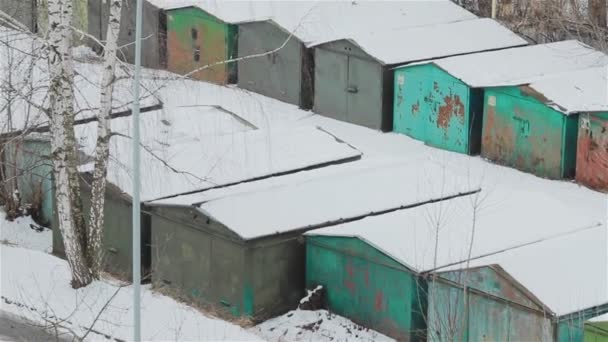 Rows of old school garages in winter. Pan - Footage, Video