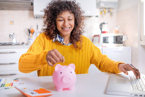 Smiling black woman saving goal for future retirement plan - Foto, afbeelding