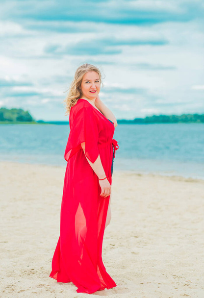 Plus size European blonde woman in stylish romantic women's summer clothes at beach. Concept of sizes, happy nice natural beautiful lady  - Φωτογραφία, εικόνα